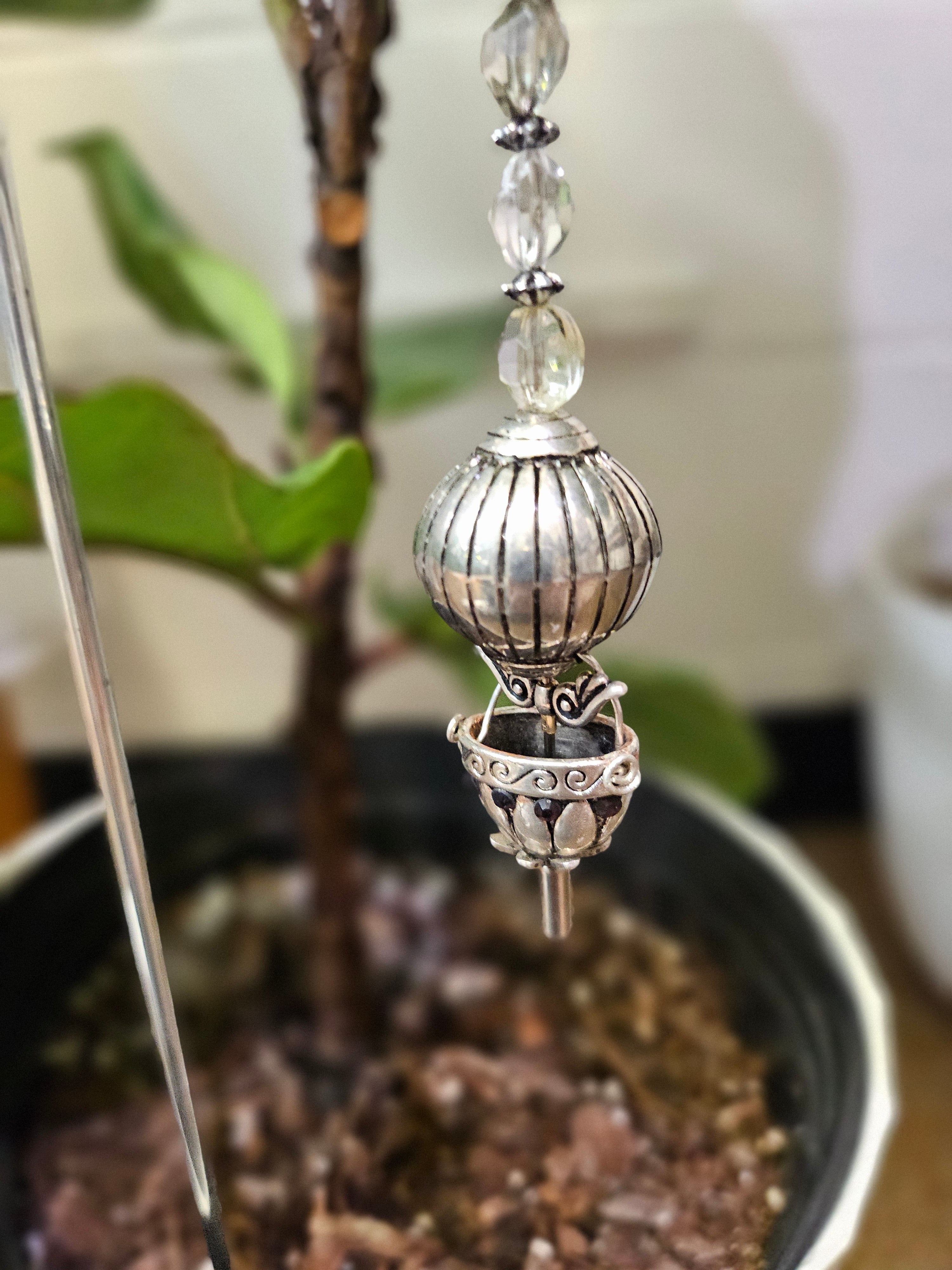 Add a touch of handcrafted magic to your plant collection with this Handmade Beaded Metal Houseplant Stake. Whether adorning a sunny windowsill, enhancing your indoor jungle, or sprucing up a patio garden, this stake offers a charming way to celebrate nature&