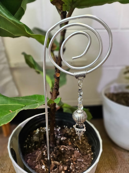 Add a touch of handcrafted magic to your plant collection with this Handmade Beaded Metal Houseplant Stake. Whether adorning a sunny windowsill, enhancing your indoor jungle, or sprucing up a patio garden, this stake offers a charming way to celebrate nature&