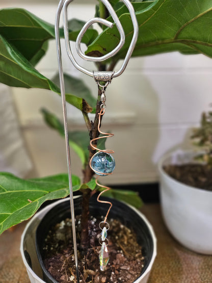 Add a touch of handcrafted magic to your plant collection with this Handmade Beaded Metal Houseplant Stake. Whether adorning a sunny windowsill, enhancing your indoor jungle, or sprucing up a patio garden, this stake offers a charming way to celebrate nature&