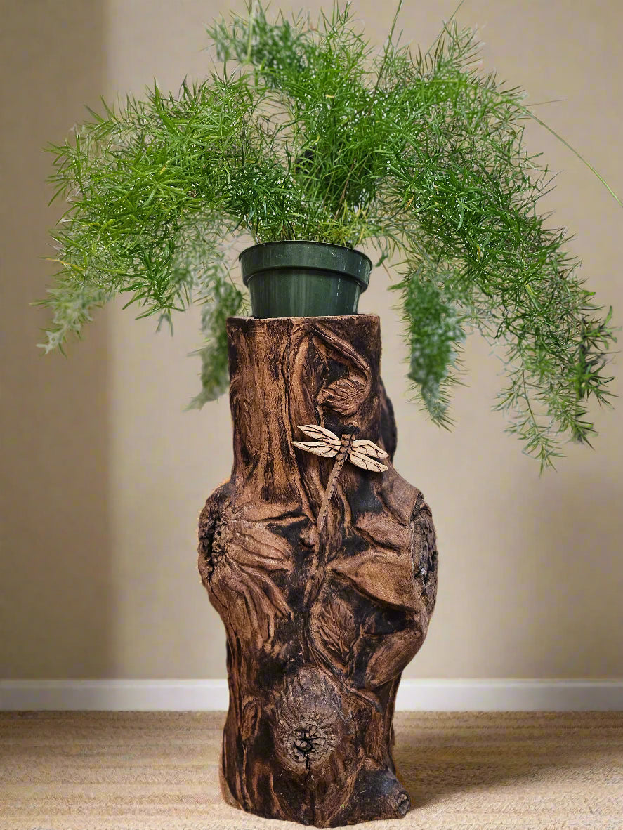 The Hand-Carved Dragonfly Outdoor Planter and Solar Light Wood Spirit in Solid Walnut (30&quot; x 10&quot;). 100% handmade, each piece is unique and perfect for home decor. The natural walnut grain and artisanal craftsmanship add rustic charm, making it a standout decorative piece for any space.