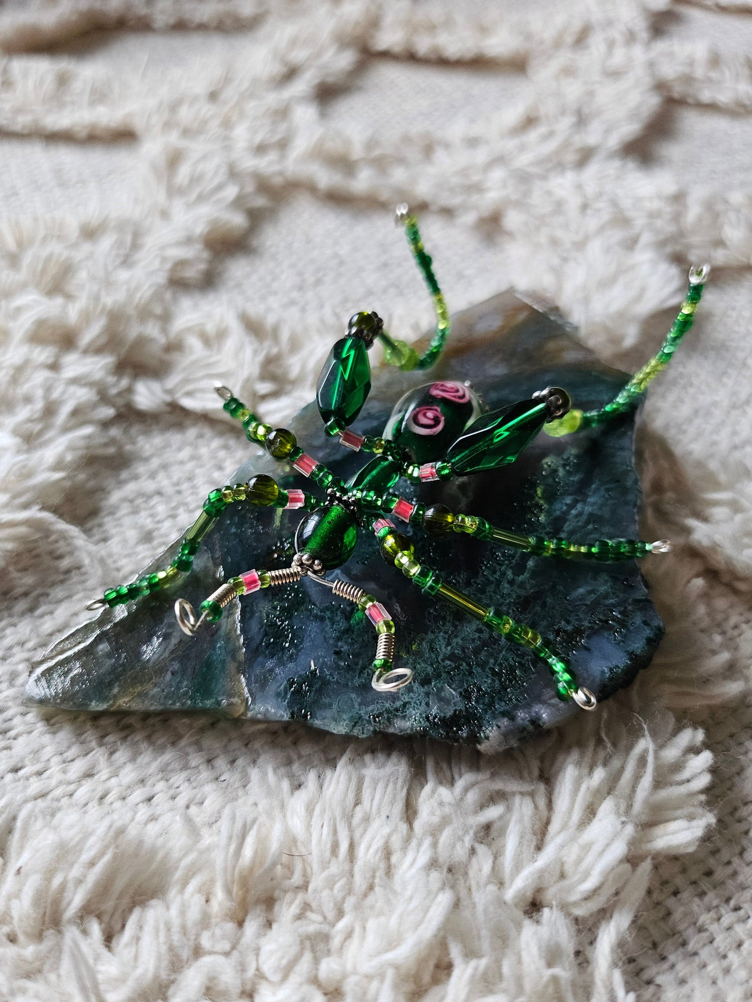 Discover KStonely’s Jeweled Insect and Creature Art on Semi-Precious Stone, featuring stunning 3D beaded sculptures. Crafted with glass crystals, agate, pearls, and fine beads on semi-precious stone. Each piece celebrates nature’s beauty. Perfect as decor or gifts.