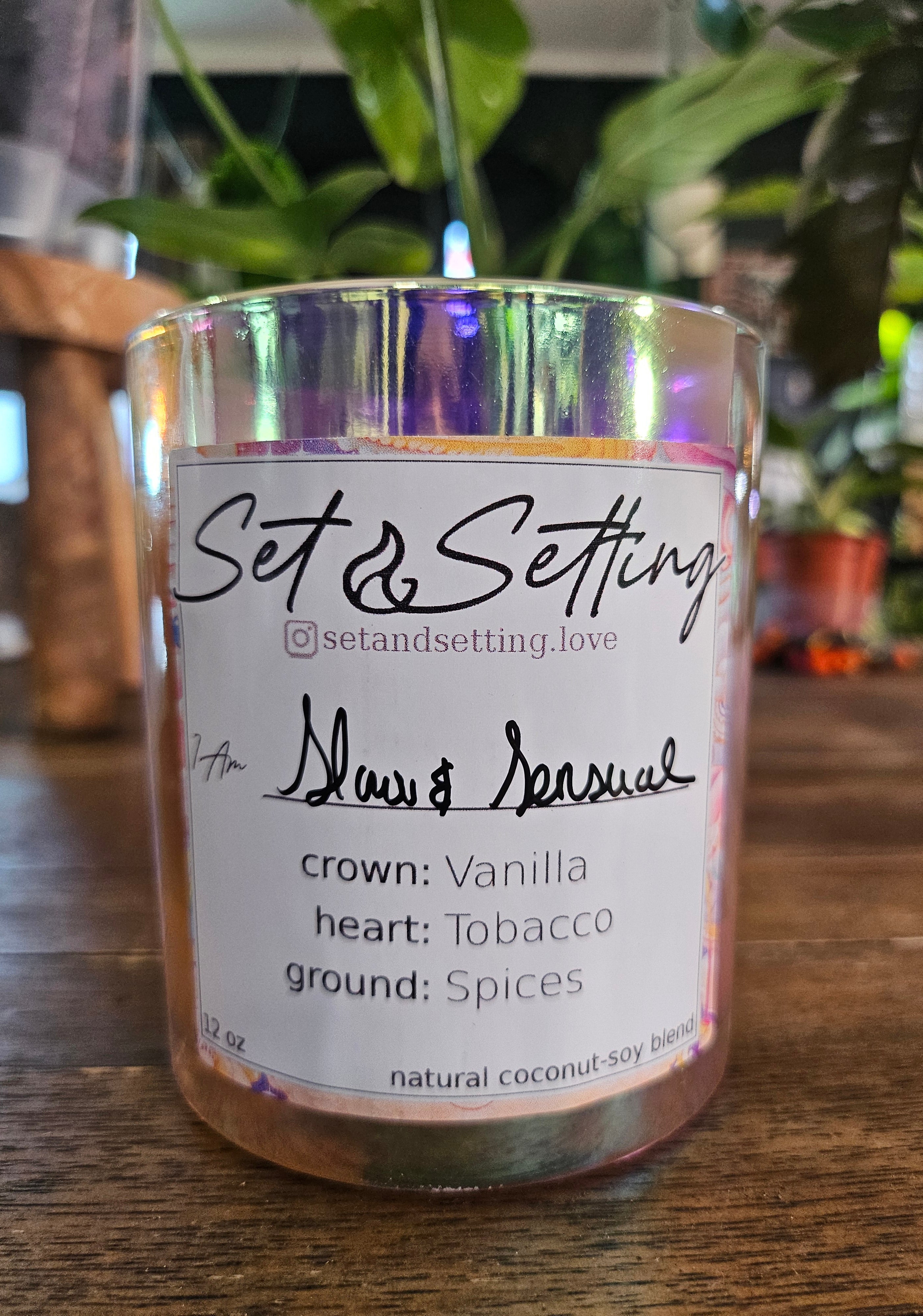 Slow &amp; Sensual 12oz Candle by Set &amp; Setting Love features a rich blend of vanilla, tobacco, and spices in an iridescent glass jar. Made with a natural coconut-soy wax blend, it offers a clean, eco-friendly burn. Perfect for romantic evenings, self-care, and gifting, it creates a warm, intimate ambiance.