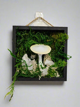 Woodland Miniatures by Angel Singh is a charming collection of four 5" x 5" mixed-media art pieces featuring mushrooms, gemstones, and blossoms. Blending preserved natural textures with handcrafted details, this series celebrates forest magic. Perfect for woodland-inspired décor or cozy spaces.